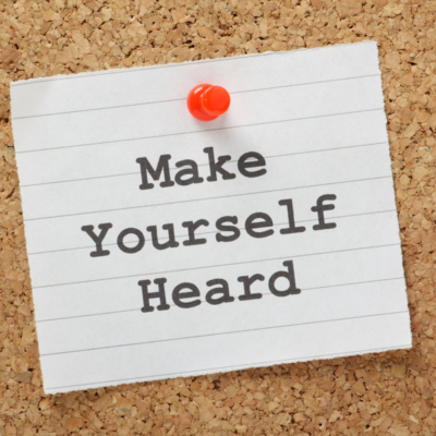 Note posted on cork board that says "Make Yourself Heard"