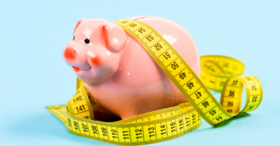 Image included is of a Piggy Bank with measuring tape wrapped around it